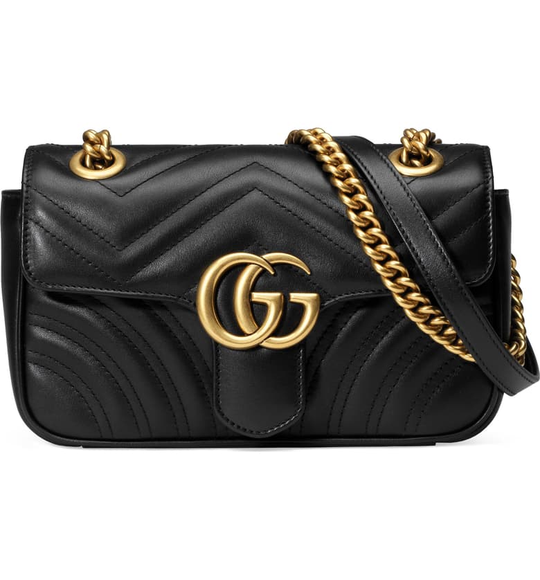 Black Gucci Mini Bag with gold strap.
Luxury gift ideas.
