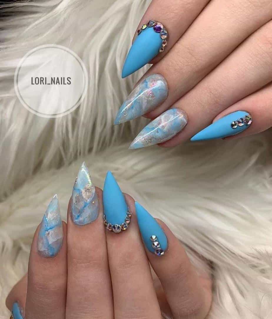 Blue pretty nails designs with rhinestones .